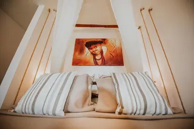 Uma cama ou camas num quarto em Hotel Rede Beach