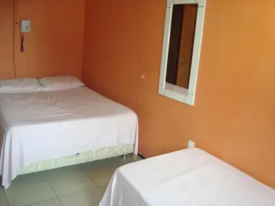 Uma cama ou camas num quarto em Pousada Vianna's