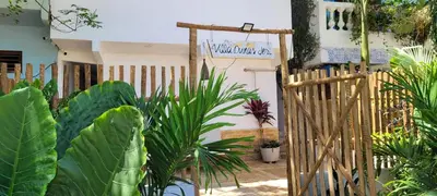 Um jardim no exterior de Villa Dunas Jeri