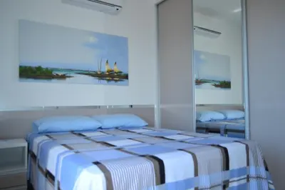 Uma cama ou camas num quarto em Residence Taormina no Cumbuco