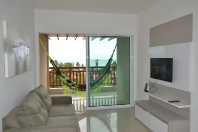 Uma televisão e/ou sistema de entretenimento em Residence Taormina no Cumbuco