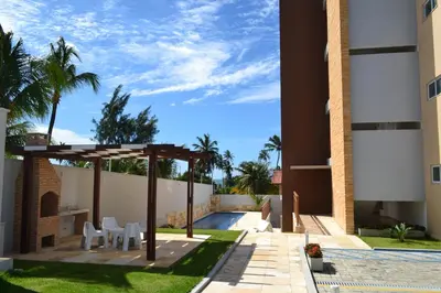 Um jardim no exterior de Residence Taormina no Cumbuco