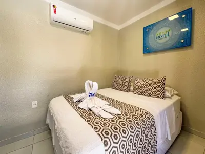 Uma cama ou camas num quarto em Rede Andrade Mini