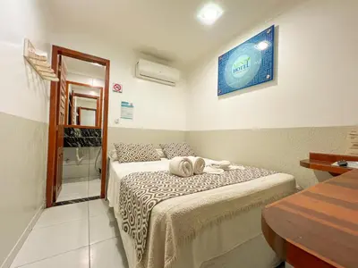 Uma cama ou camas num quarto em Rede Andrade Mini
