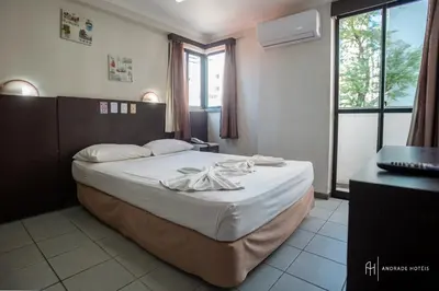 Uma cama ou camas num quarto em Rede Andrade Casa Blanca