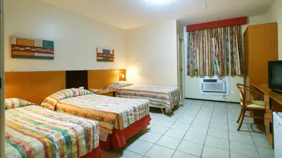 Uma cama ou camas num quarto em Aquaville Aquiraz Hotel