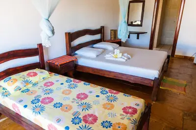 Uma cama ou camas num quarto em Casa Cumbuco e Hospedaria