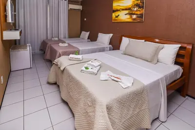 Uma cama ou camas num quarto em Pousada Brasil Cumbuco