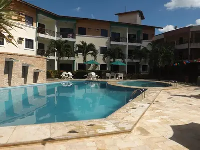 A piscina em ou perto de CONDOMÍNIO VILA DO MAR aptos 201C e 211B