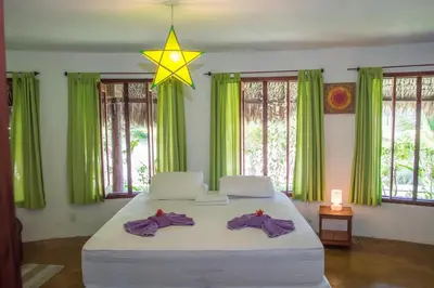 Uma cama ou camas num quarto em Refugios Parajuru - Villa Alegre