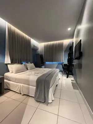 Uma cama ou camas num quarto em Fortpraia Hotel