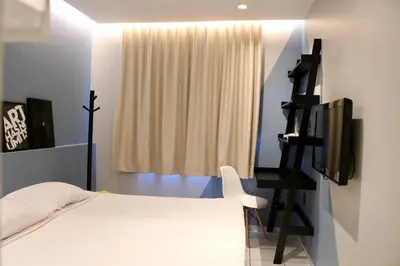 Uma cama ou camas num quarto em Fortpraia Hotel