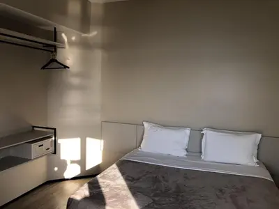 Uma cama ou camas num quarto em Particular Golden Beira Mar