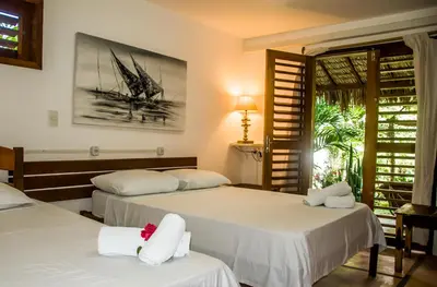 Uma cama ou camas num quarto em Residence Bons Ventos Jeri