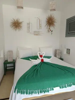 Uma cama ou camas num quarto em Pousada Recanto Beija-Flor
