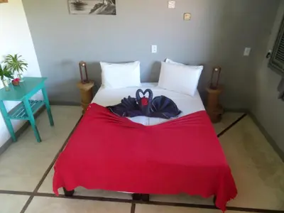 Uma cama ou camas num quarto em Pousada Recanto Beija-Flor