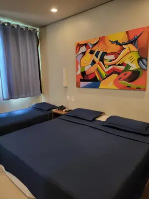 Uma cama ou camas num quarto em Hotel Encontro do Sol