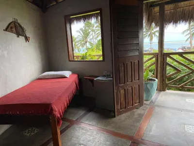Uma cama ou camas num quarto em Pousada Bate Vento