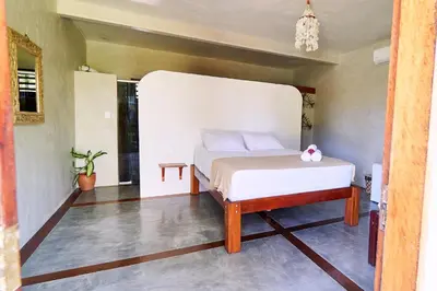 Uma cama ou camas num quarto em Pousada Bate Vento