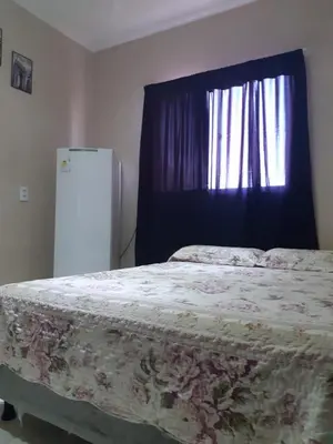 Uma cama ou camas num quarto em Suítes Canaã