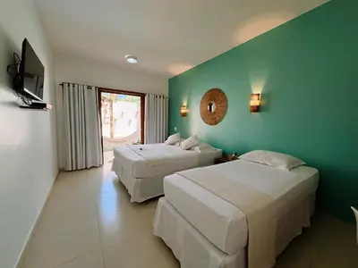 Uma cama ou camas num quarto em Pousada Jeri Dunas