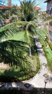 Um jardim no exterior de APARTAMENTOS NO CARTIER PRAIA DO FUTURO FORTALEZA CONFORTAVEL COM 2 QRTOS 1 suite