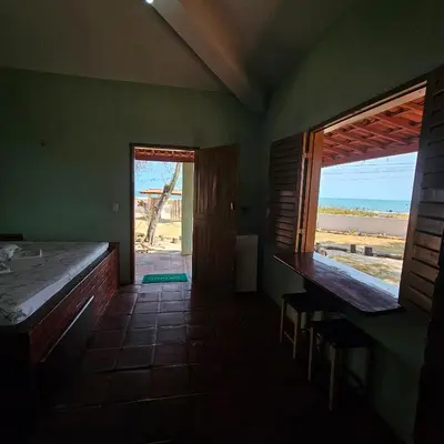 Uma cama ou camas num quarto em Pousada Mae Natureza Icapuí