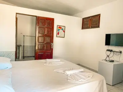 Uma cama ou camas num quarto em Pousada La Goduria