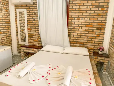 Uma cama ou camas num quarto em Pousada La Goduria