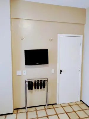 Uma televisão e/ou sistema de entretenimento em Nobile Suítes Golden Fortaleza