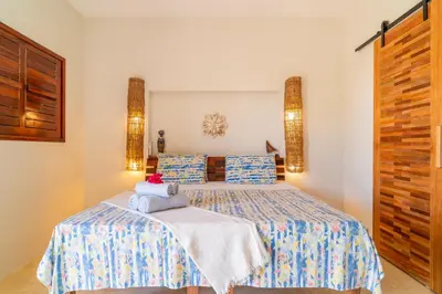 Uma cama ou camas num quarto em Bangalo Das Dunas