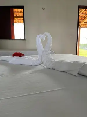 Uma cama ou camas num quarto em Pousada Recanto da Mãezinha