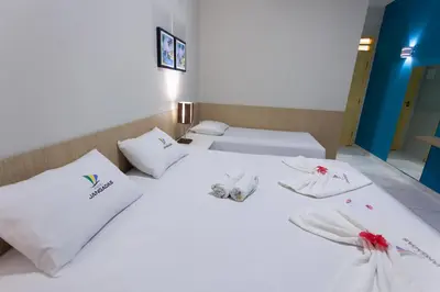 Uma cama ou camas num quarto em Hotel Jangadas