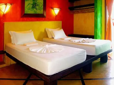 Uma cama ou camas num quarto em Ibiscus Pousada sem café