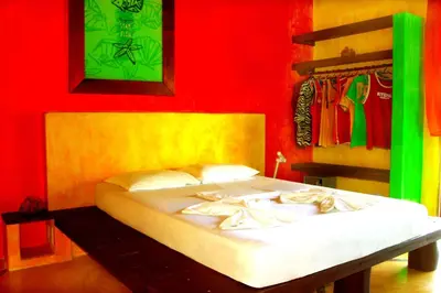 Uma cama ou camas num quarto em Ibiscus Pousada sem café