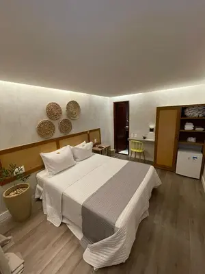 Uma cama ou camas num quarto em Pousada do Paiva
