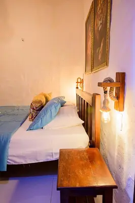 Uma cama ou camas num quarto em Olho D'Água Pousada