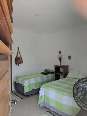 Uma cama ou camas num quarto em B&B Chalé Jardins