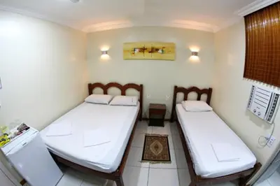 Uma cama ou camas num quarto em Hotel Belem Fortaleza