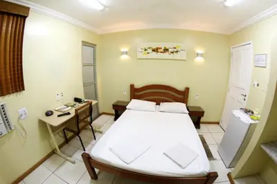 Uma cama ou camas num quarto em Hotel Belem Fortaleza
