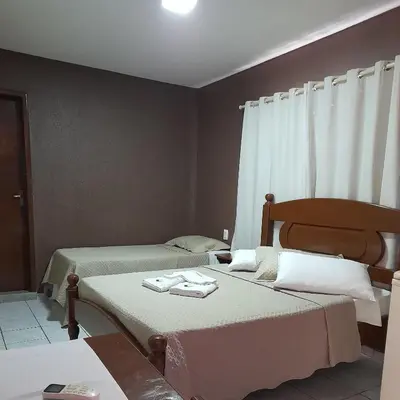Uma cama ou camas num quarto em Pousada Tartaruga Cumbuco