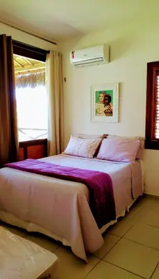 Uma cama ou camas num quarto em Bangalô Eco Residence Flecheiras