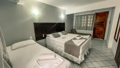 Uma cama ou camas num quarto em Falésia Praia Hotel