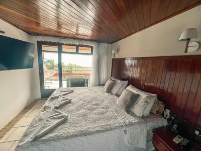 Uma cama ou camas num quarto em Falésia Praia Hotel