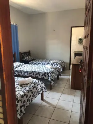 Uma cama ou camas num quarto em Pousada do Holandês