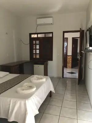 Uma cama ou camas num quarto em Pousada do Holandês