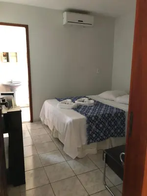 Uma cama ou camas num quarto em Pousada do Holandês