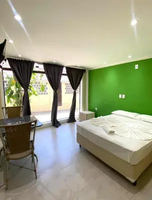 Uma cama ou camas num quarto em Pousada do Toby