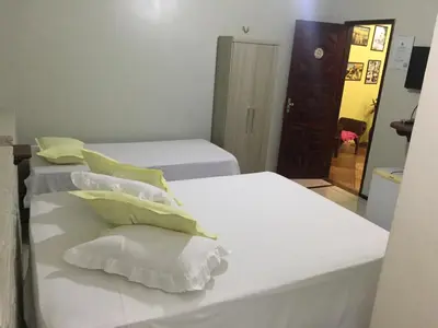 Uma cama ou camas num quarto em Pousada Alternativa