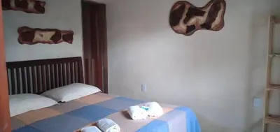 Uma cama ou camas num quarto em Casa de veraneio